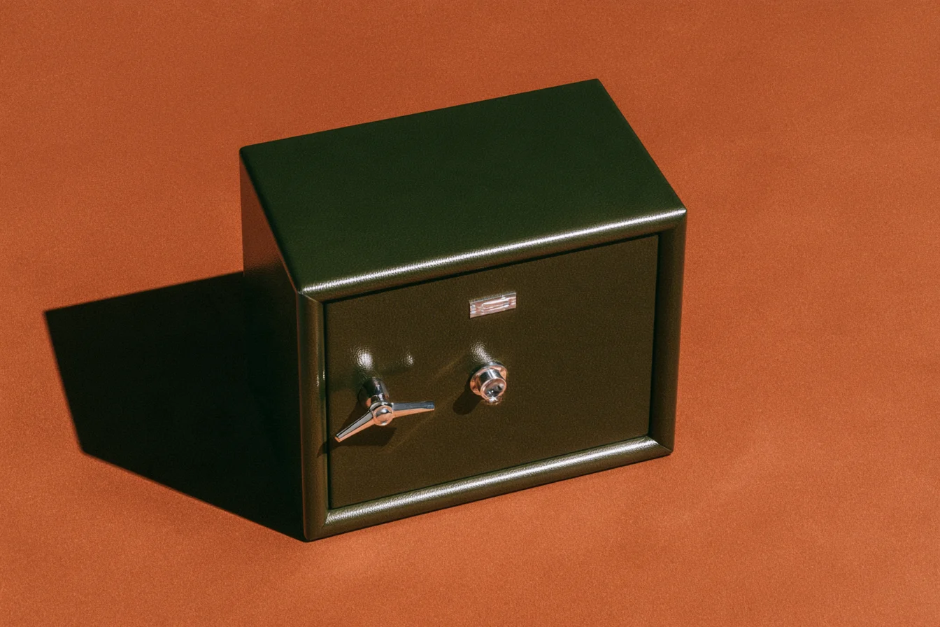 Dark green safe on an orange background