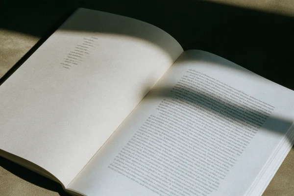 Open book in sunlight and shadow