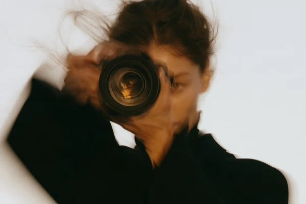 A woman holding a camera