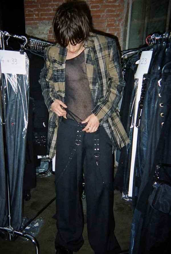 Person in Plaid Blazer and Mesh Top