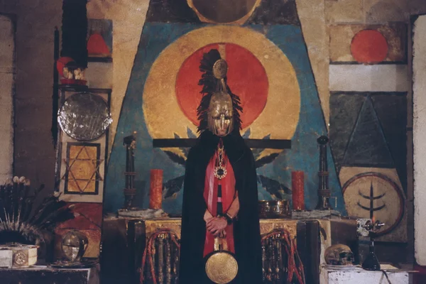 A Person in Ceremonial Robes and Helmet