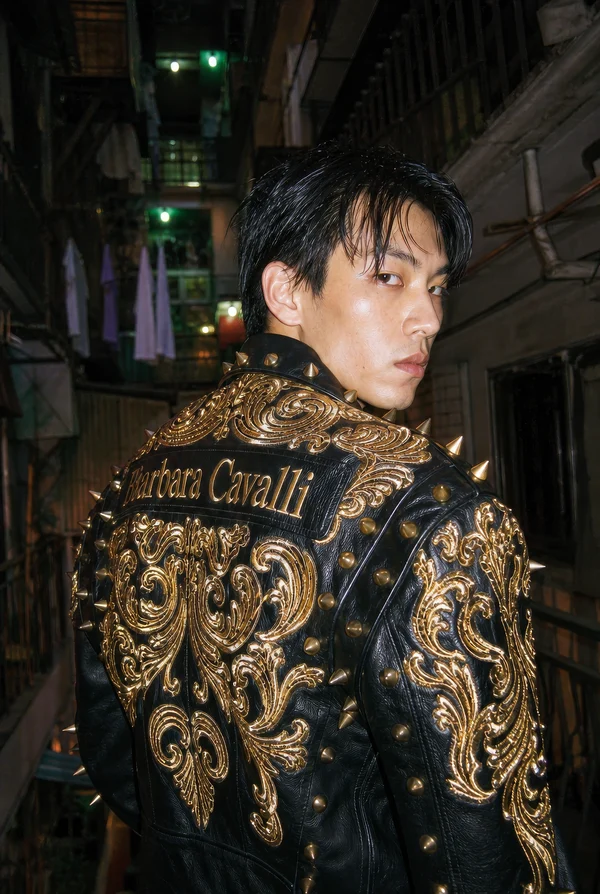 Man Wearing Ornate Gold Studded Leather Jacket