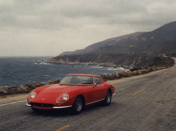 Vintage Red Sports Car on a Coastal Road