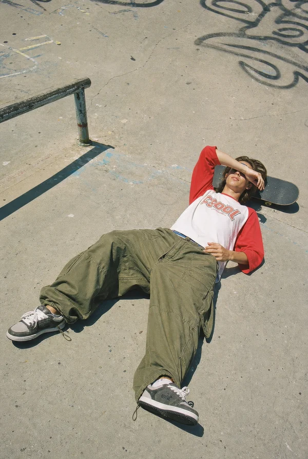 Skater Resting on Concrete Ground