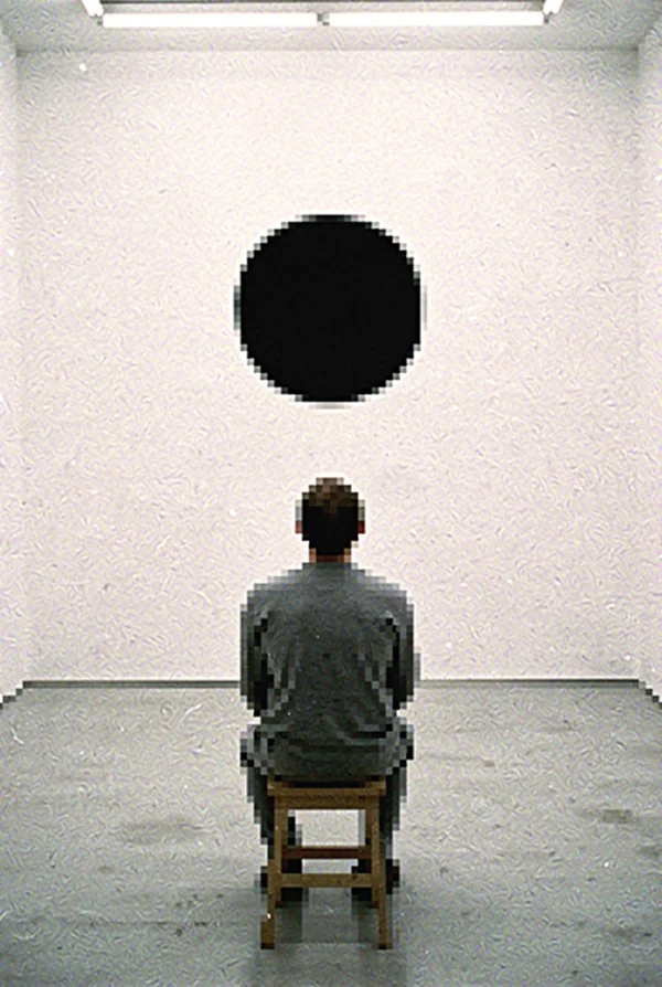 Person Observing a Black Circle in a Gallery