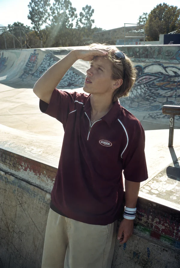 Young man standing at a skatepark