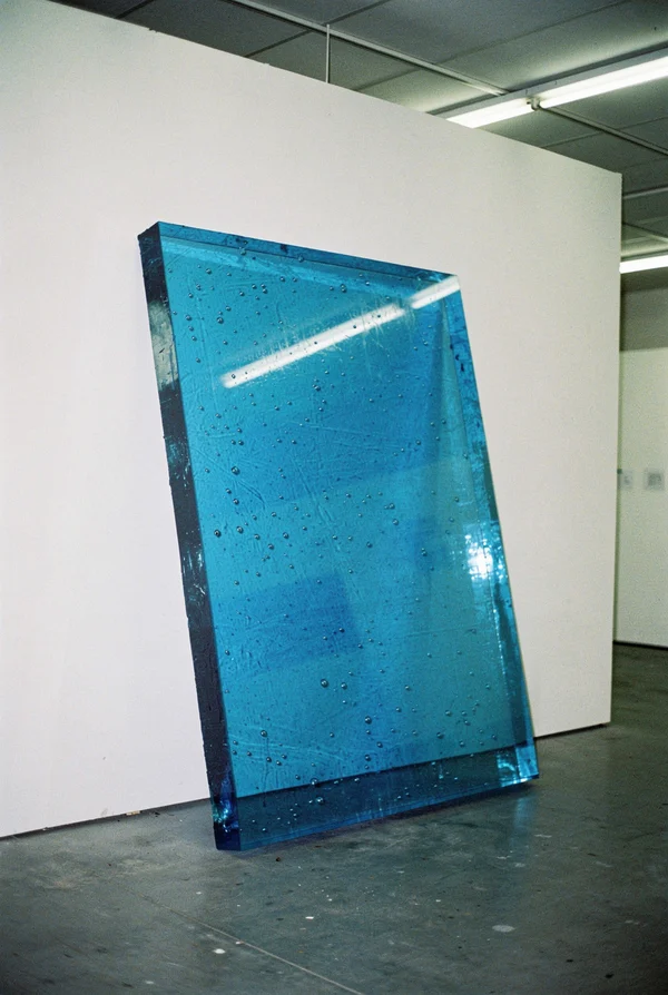 Large Blue Glass Sculpture in a Gallery