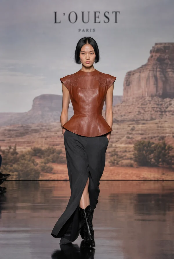 Model on Runway in Leather Peplum Top