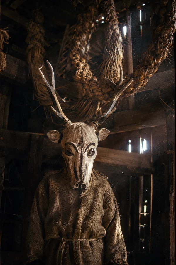 Figure in a Deer Mask and Burlap Robe