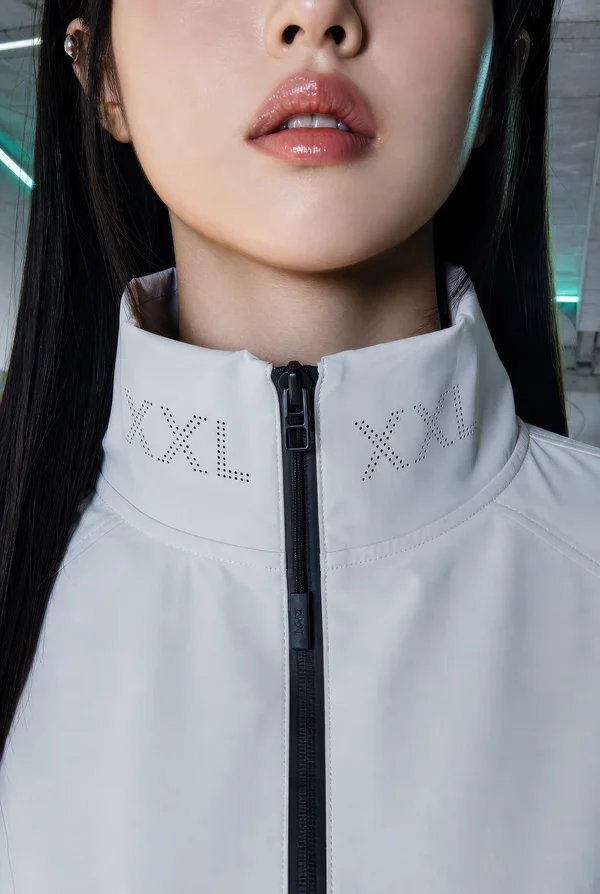 Close up of a person wearing a white jacket