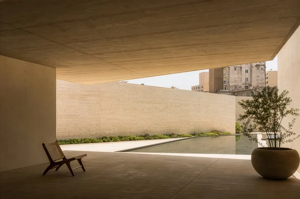 Minimalist Concrete Patio with Reflecting Pool