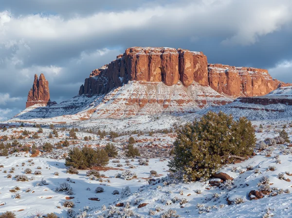Snowy Desert Landscape with Red Rock Formations