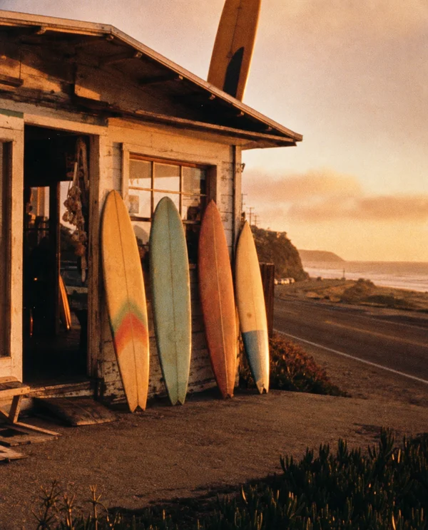 Surfboards Leaning Against a Coastal Shack