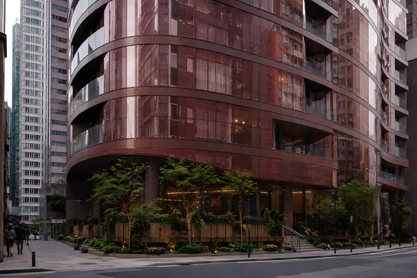 Modern Curved Building with Urban Greenery