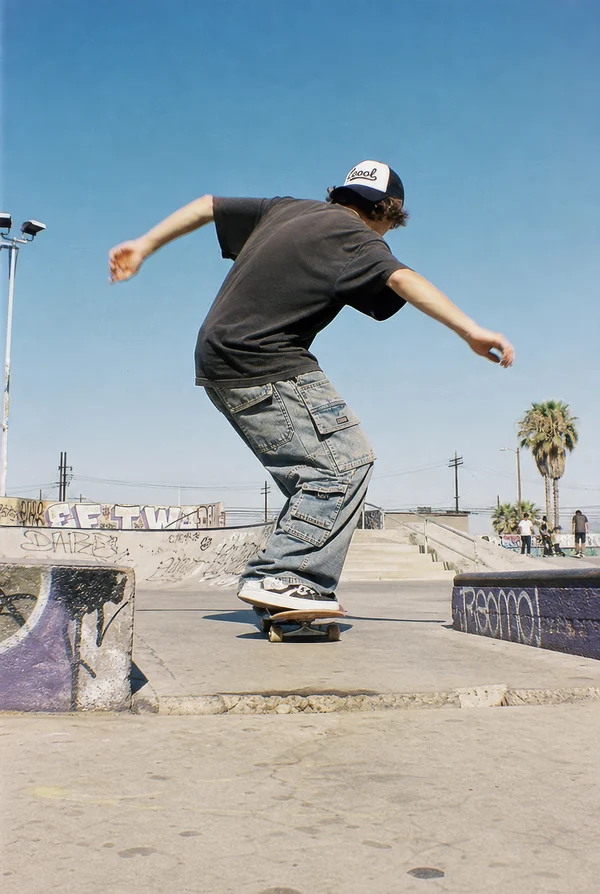 Skateboarder Performing a Trick at a Skatepark