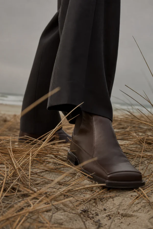 Brown Leather Boots on Sandy Beach