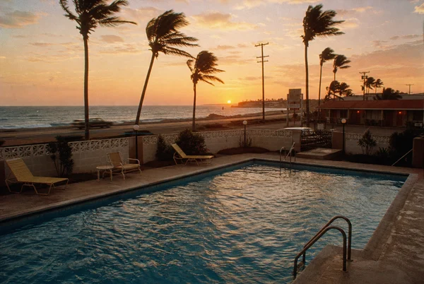 Sunset View Over a Coastal Swimming Pool