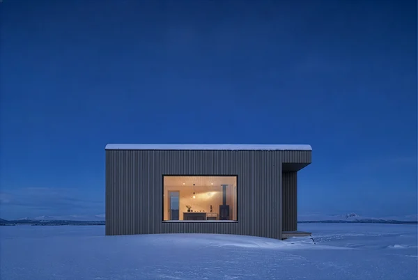 Modern Cabin in a Snowy Landscape