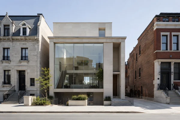 Modern Glass House Between Historic Buildings