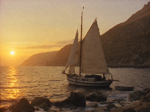Sailboat Anchored at Sunset