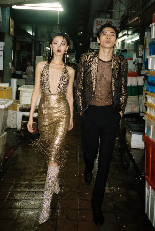 Fashionable Couple Walking in a Market Alley