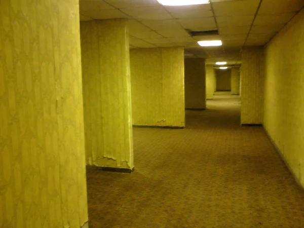 Empty Yellow Office Corridor