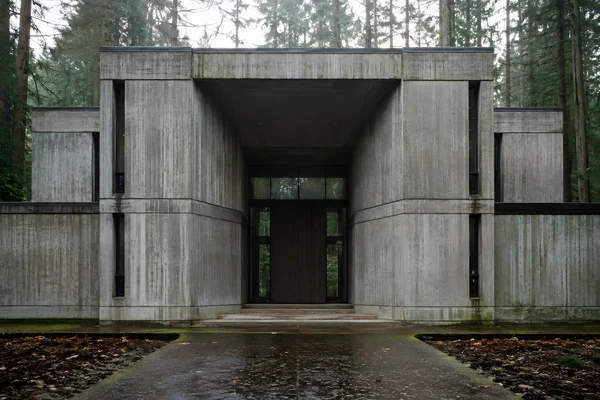 Brutalist Concrete Building in Forest Setting