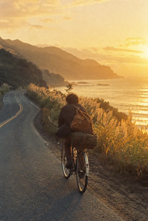 A Cyclist Traveling Along a Coastal Road