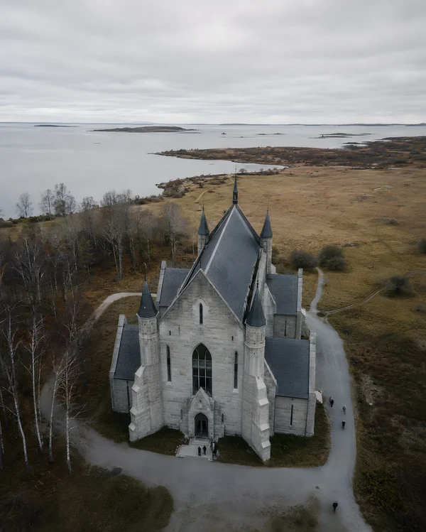Aerial View of a Stone Church by the Coast