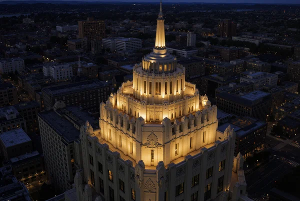 Aerial View of an Illuminated Skyscraper at Night