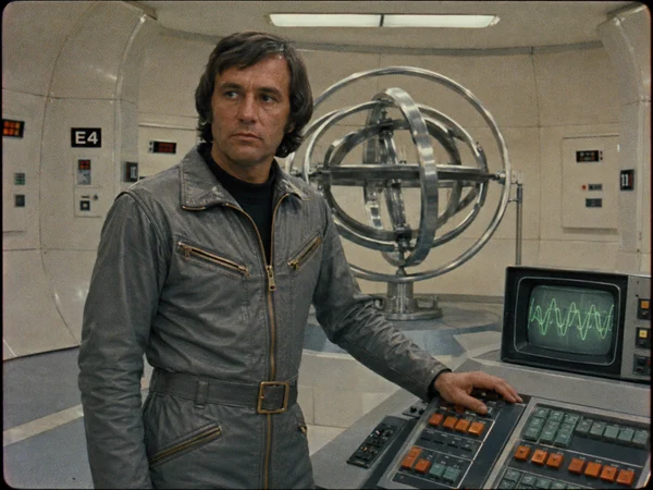 Man Operating Futuristic Control Console
