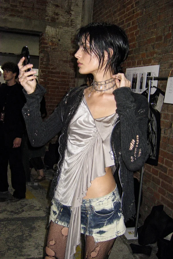 Model preparing backstage at a fashion show