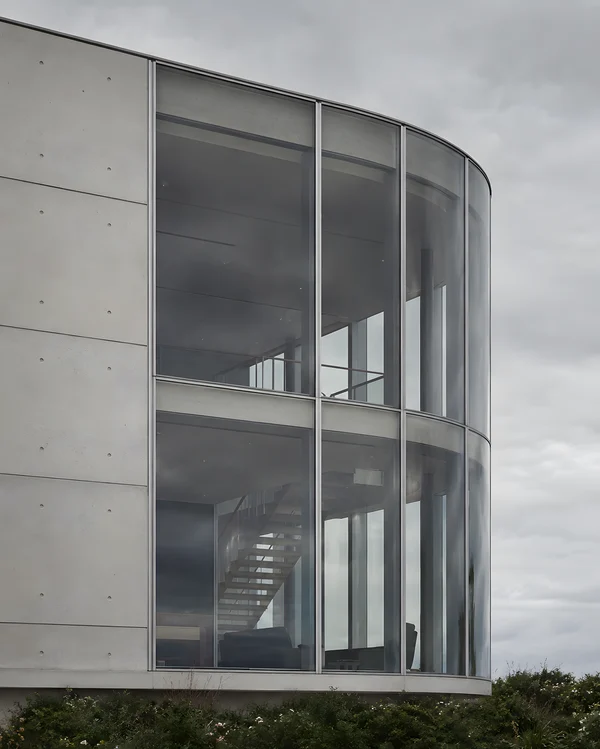 Modern Curved Glass and Concrete Architecture