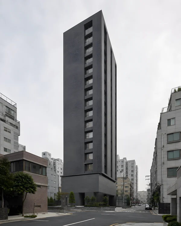 Modern Dark Gray Skyscraper in Urban Setting