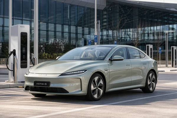 Modern Electric Sedan at Charging Station