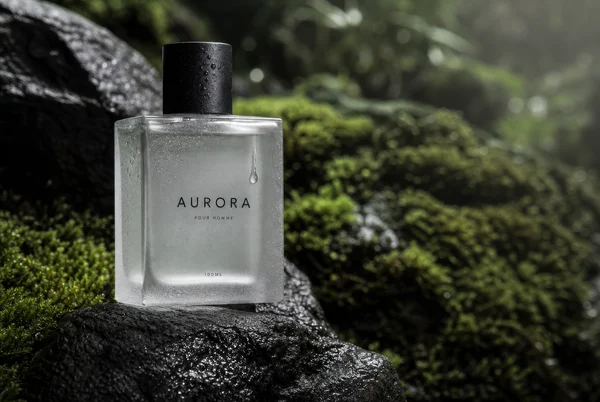 Minimalist Perfume Bottle on Mossy Rock