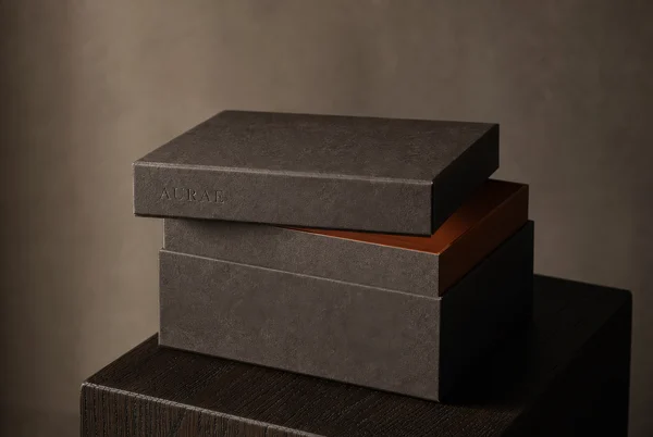 Minimalist Charcoal Gift Box on Wooden Pedestal