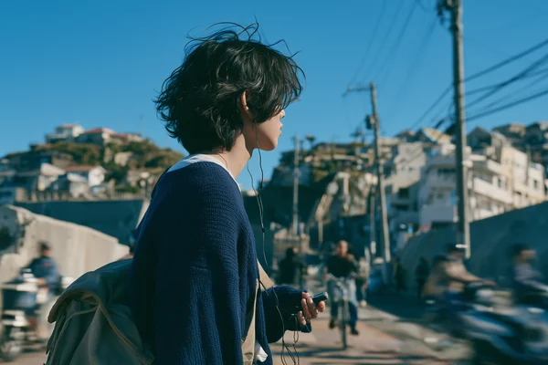 Young Man Standing in a Coastal Town