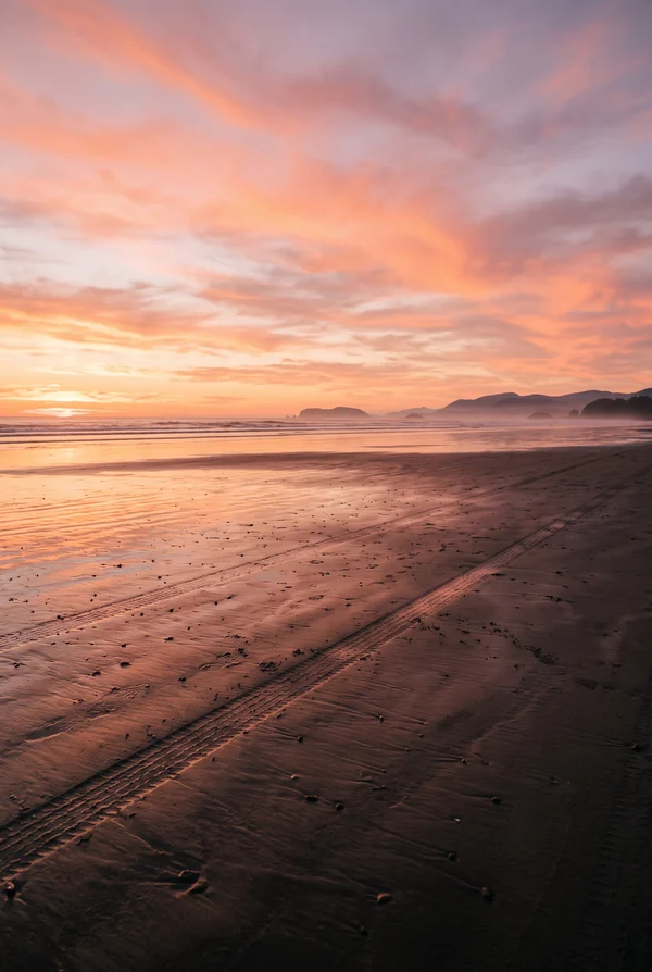 Sunset Over a Deserted Sandy Beach