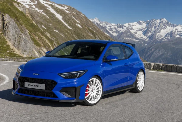 Blue Performance Hatchback on Mountain Road