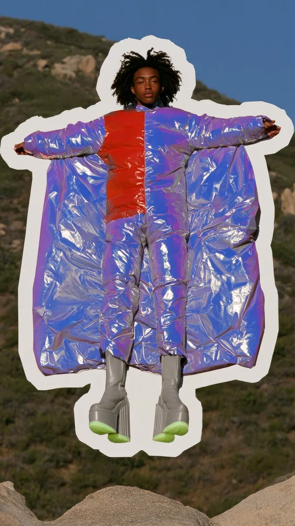 Iridescent Puffer Suit Model in Mid-Air Pose