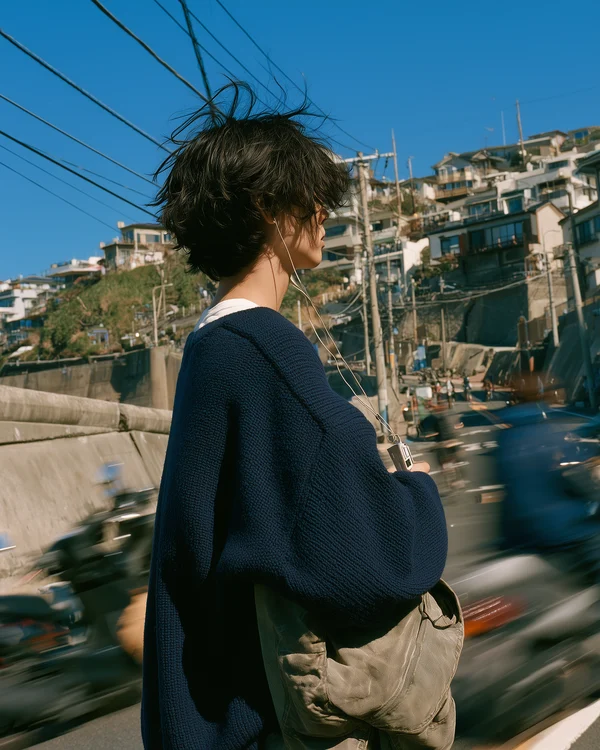 A Young Man Standing in a Coastal Town