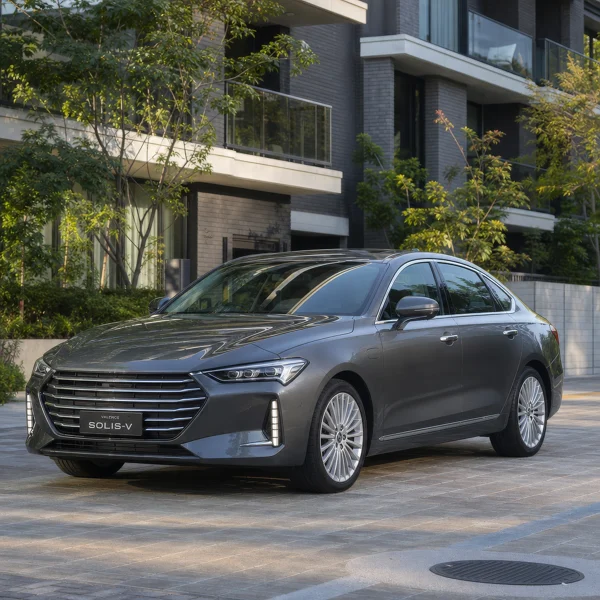 Metallic Grey Sedan Parked in Modern Driveway