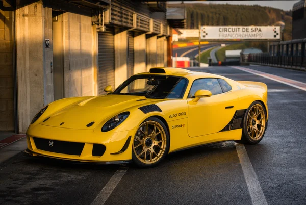 Yellow Sports Car at Racetrack Pit Lane