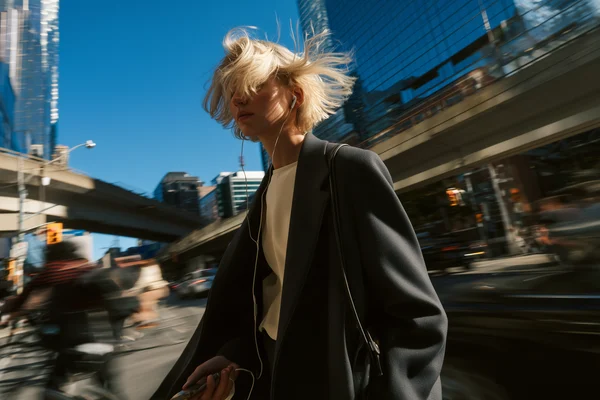 Woman Walking Through a Busy City Street