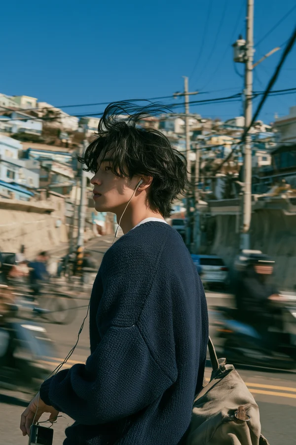 Young Man Standing in a Coastal Town