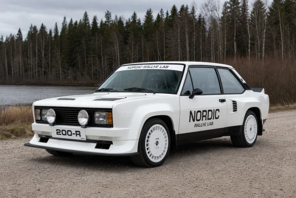 White Rally Coupe on Gravel Road