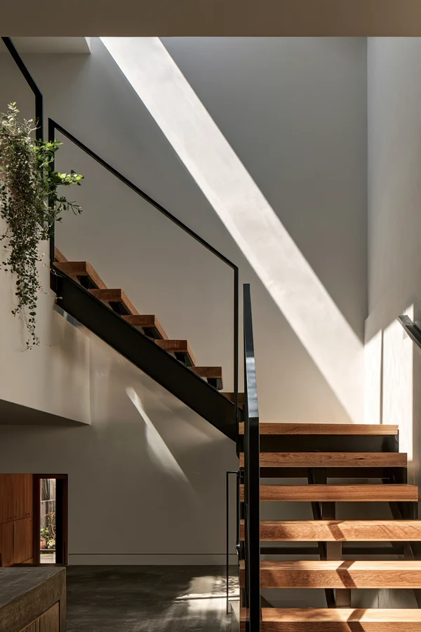 Modern Steel and Oak Staircase in Sunlight