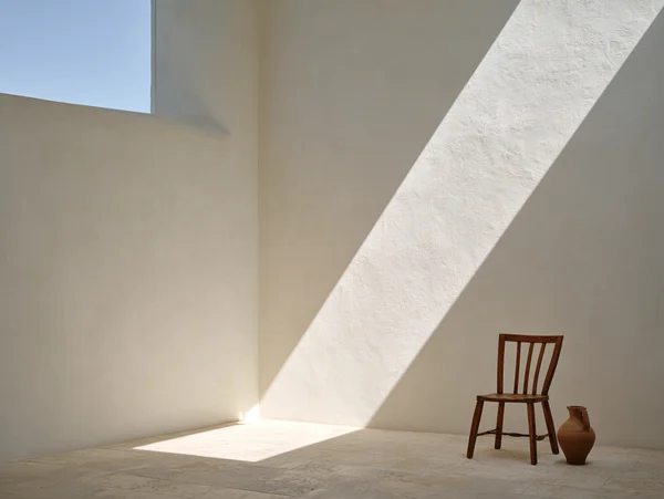 Minimalist Room with Wooden Chair and Jug