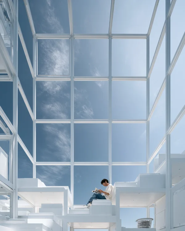 Minimalist White Cubic Structure with Reader